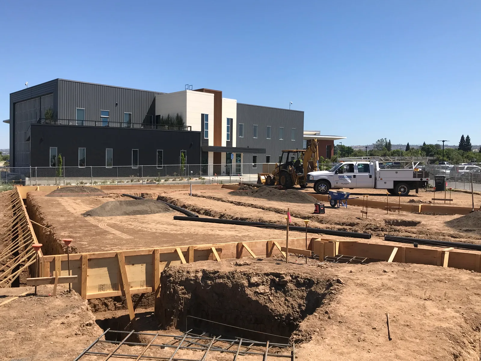 Concrete foundation formwork across a large construction site