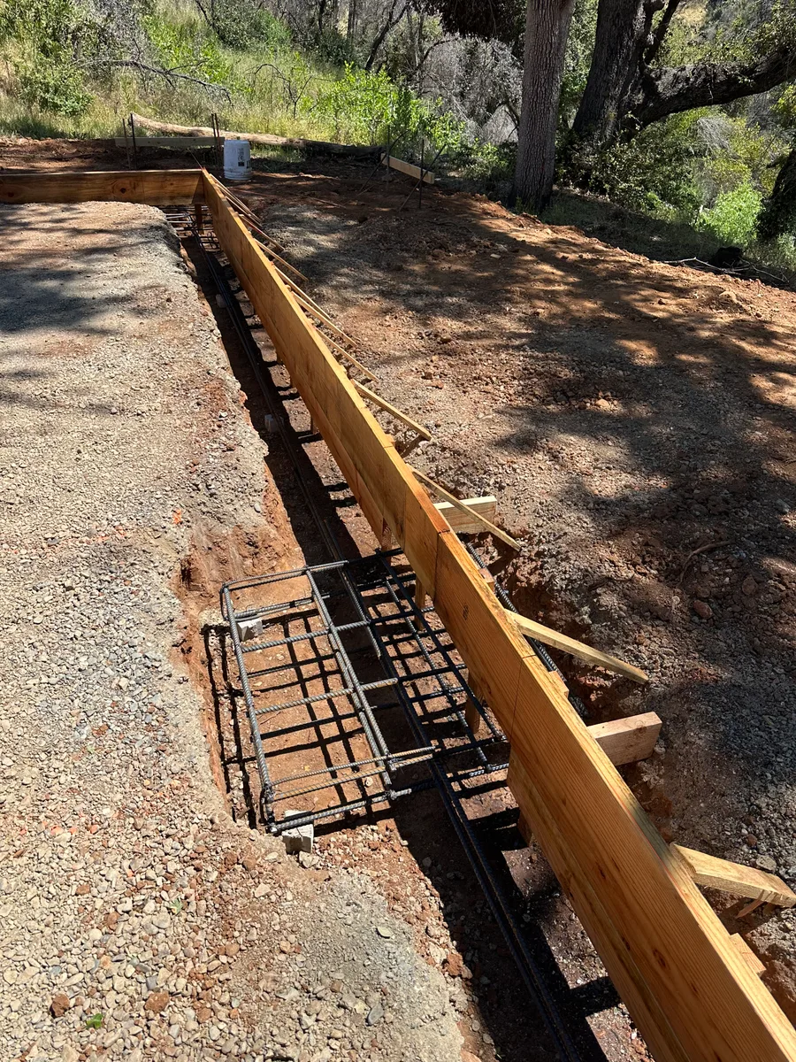 Reinforcing steel positioned inside timber foundation forms